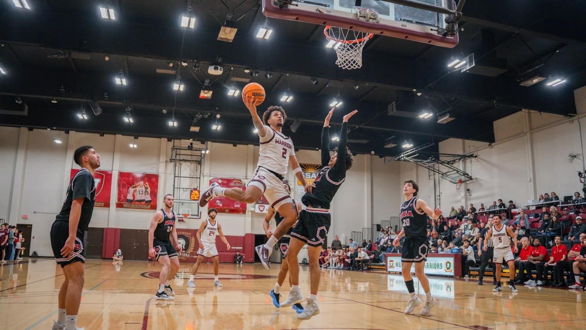 Adrian McIntyre goes in for a dunk.