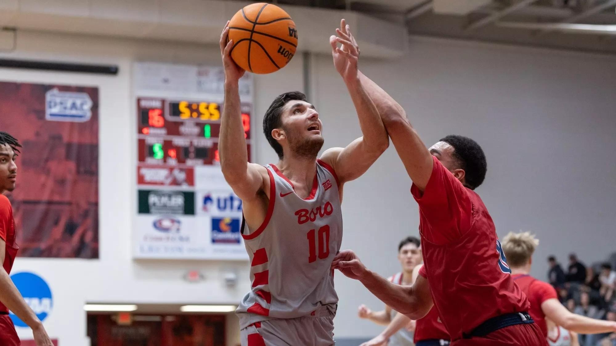 Cenker Evran goes to the basket for Edinboro. 