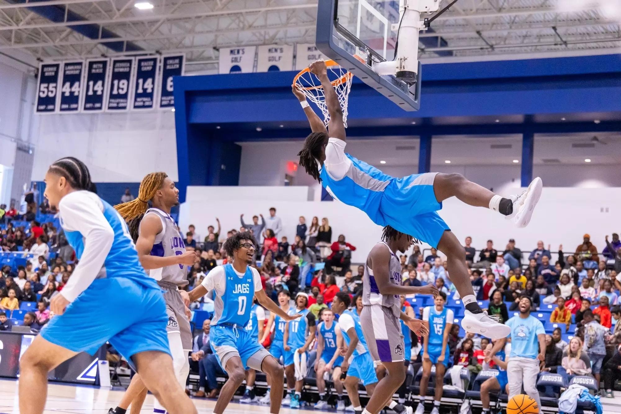 Max Amadasun rips down the rim in DII men's basketball.