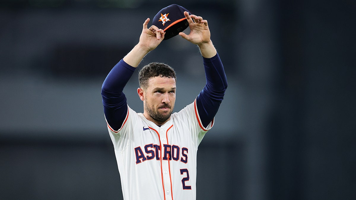 Alex Bregman waves to fans