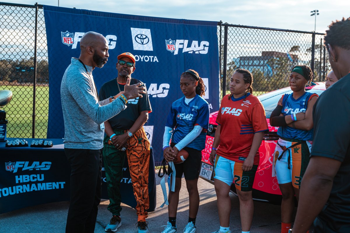 Izell Reese with Flag Football Players