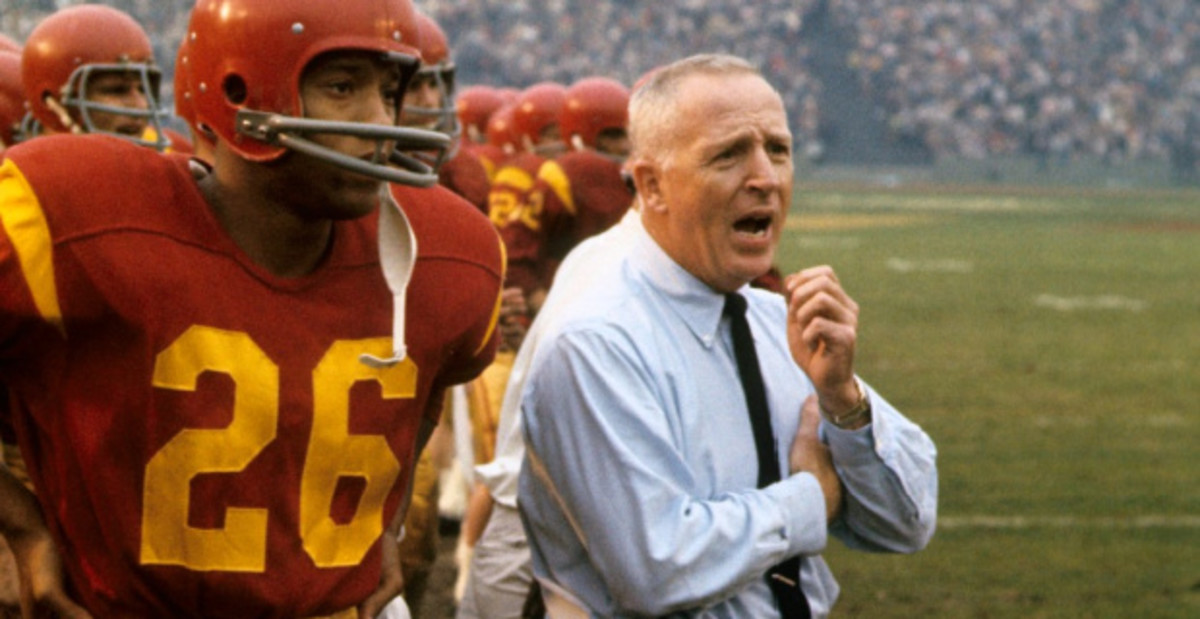 USC Trojans head coach John McKay coaching from the sideline during a college football game.