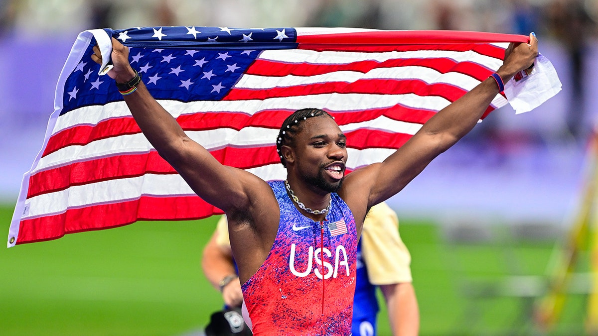 Noah Lyles with flag