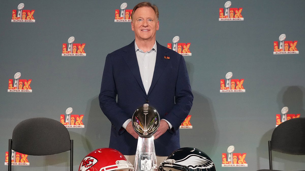 Roger Goodell poses with Vince Lombardi trophy