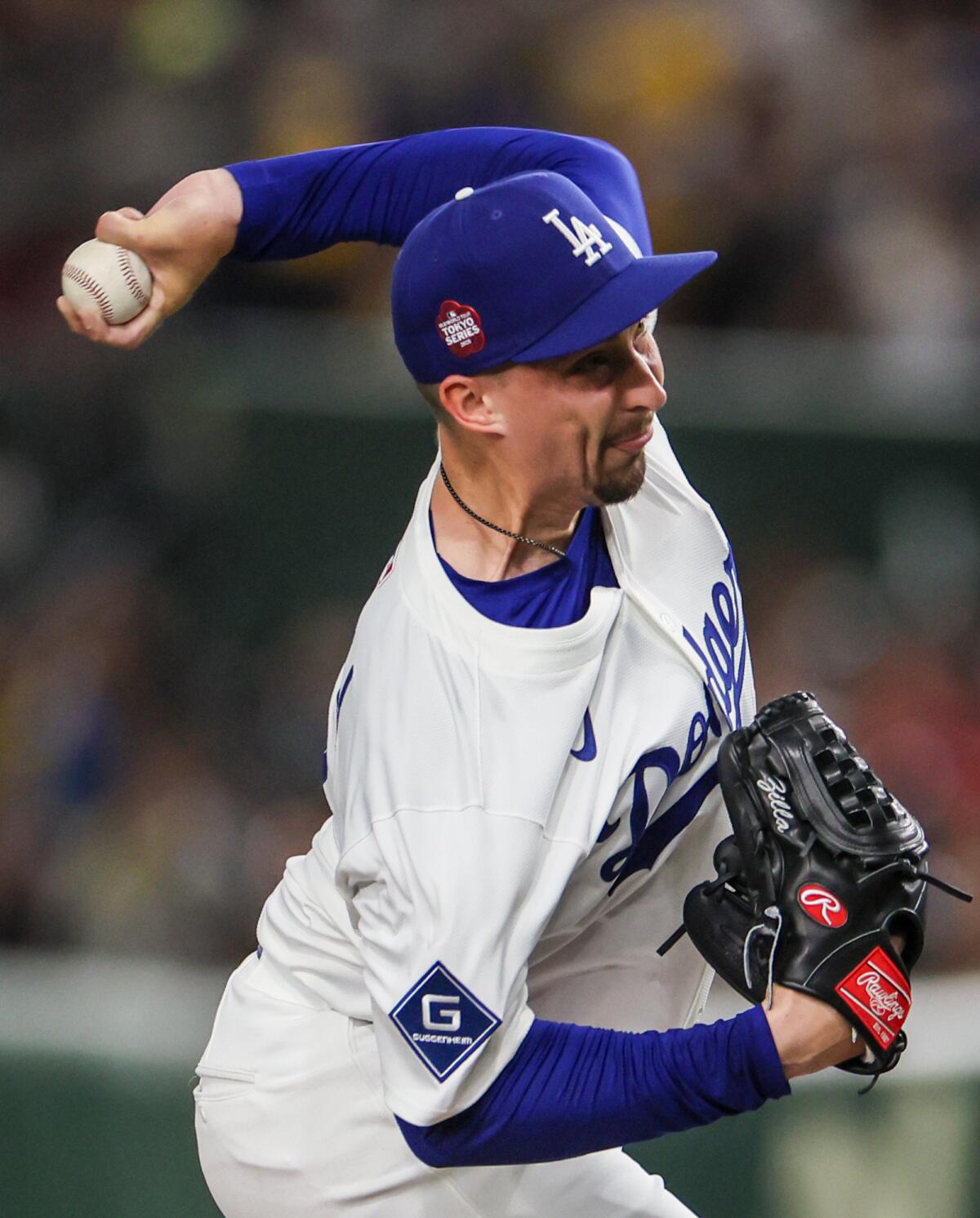 Dodgers pitcher Blake Snell delivers against the Hanshin Tigers at the Tokyo Dome on Sunday.