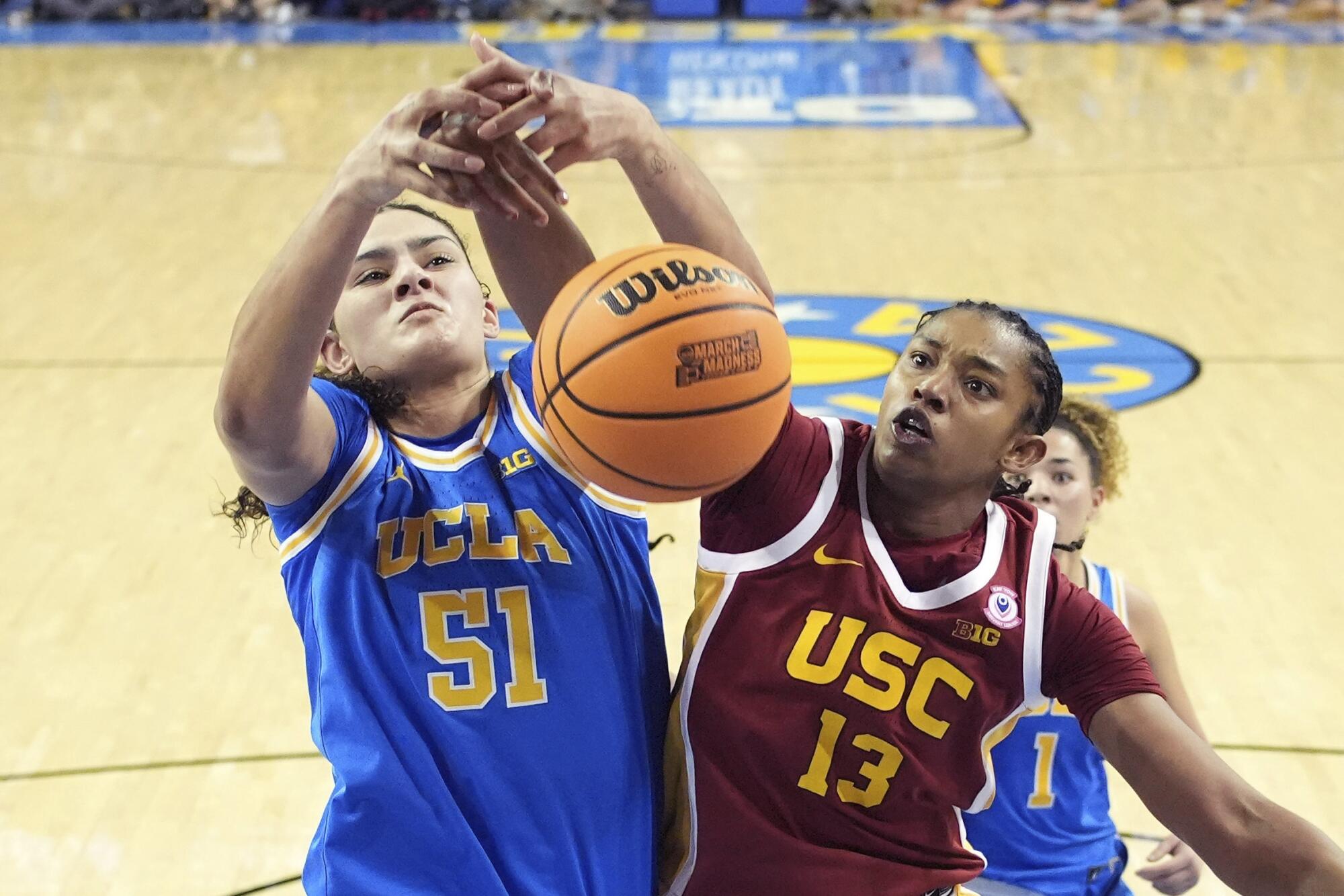 UCLA's Lauren Betts, left, and USC's Rayah Marshall go after a rebound during the second half Saturday.