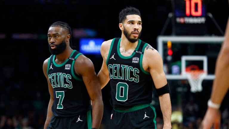 Boston Celtics forward Jayson Tatum (0) walks off the court with Boston Celtics guard Jaylen Brown (7) during the third quarter in Game 2 of the NBA Finals. The Boston Celtics hosted the Dallas Mavericks at TD Garden on Sunday, June 9, 2024.