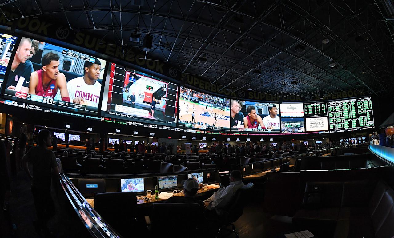 LAS VEGAS, NV - MARCH 15:  Guests attend a viewing party for the NCAA Men's College Basketball Tournament inside the 25,000-square-foot Race & Sports SuperBook at the Westgate Las Vegas Resort & Casino which features 4,488-square-feet of HD video screens on March 15, 2018 in Las Vegas, Nevada.  (Photo by Ethan Miller/Getty Images)