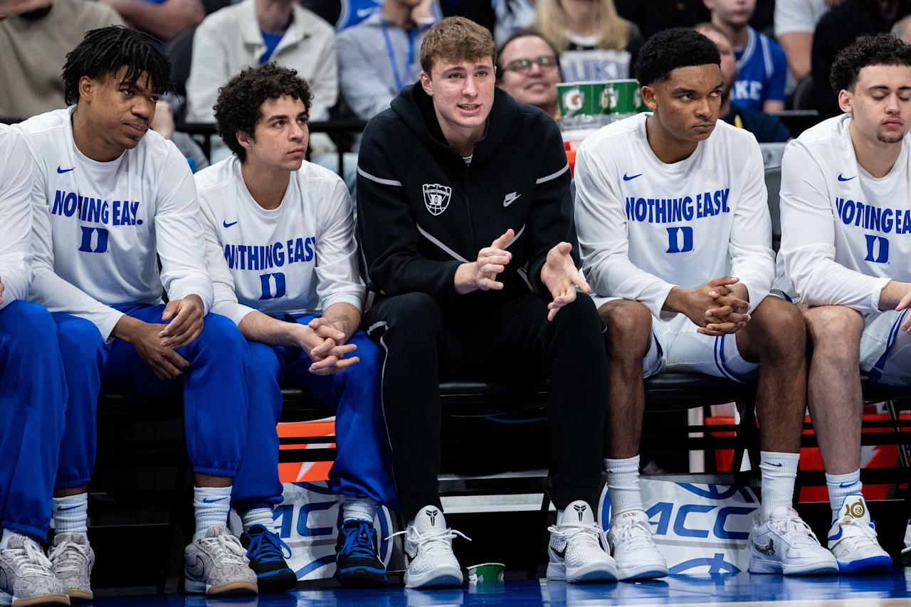 CHARLOTTE, NORTH CAROLINA - MARCH 14: Cooper Flagg #2 of the Duke Blue Devils looks on from the bench in the first half against the North Carolina Tar Heels during the semifinal round of the ACC men's basketball tournament at Spectrum Center on March 14, 2025 in Charlotte, North Carolina. (Photo by Jacob Kupferman/Getty Images)