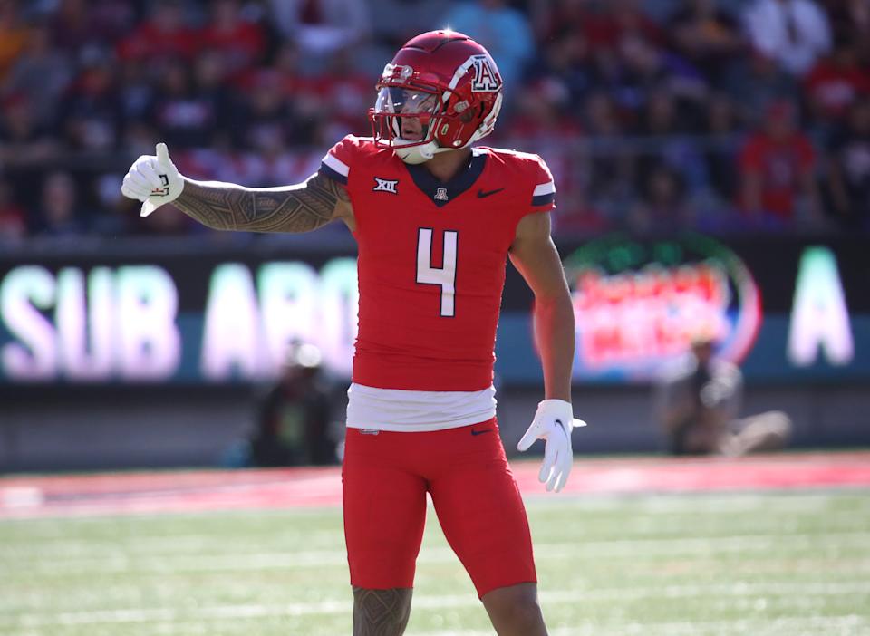 TUCSON, ARIZONA - NOVEMBER 30: Wide receiver Tetairoa McMillan #4 of the University of Arizona Wildcats checks with the referee to make sure that the offense is on the line during the first half of the University of Arizona Wildcats versus the Arizona State Sun Devils football game at Arizona Stadium on November 30, 2024 in Tucson, Arizona. (Photo by Bruce Yeung/Getty Images)