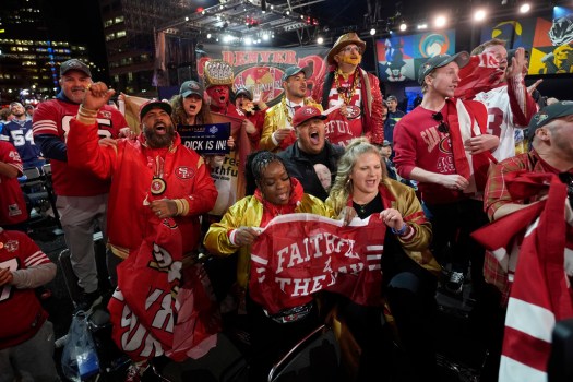 NFL Draft Football San Francisco 49ers fans cheer during the first round of the NFL football draft, Thursday, April 25, 2024, in Detroit. (AP Photo/Paul Sancya)