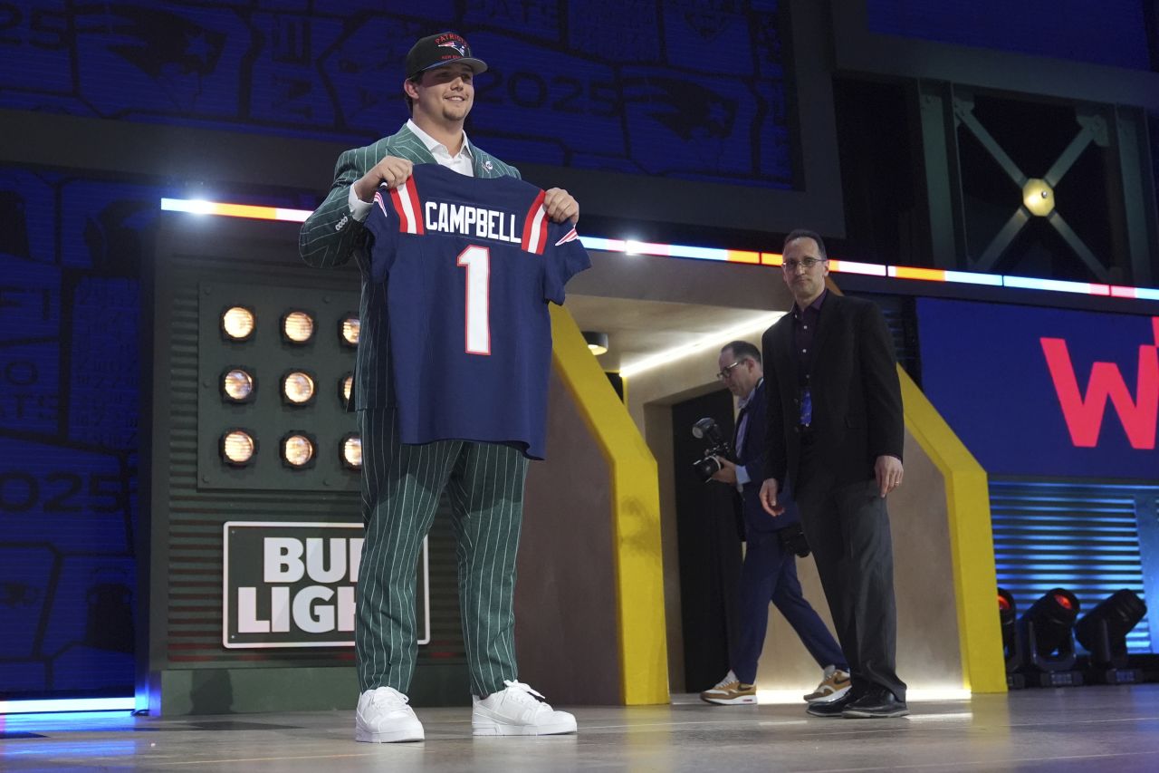 LSU offensive tackle Will Campbell shows off his Patriots jersey.