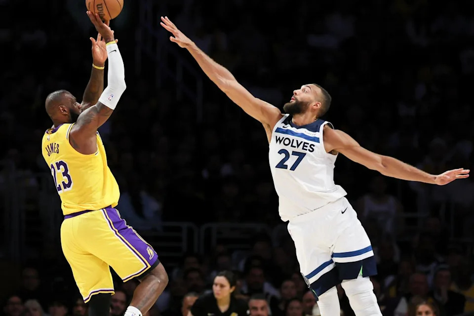 LeBron James shoots over the outstretched arms of Timberwolves center Rudy Gobert in the first quarter.