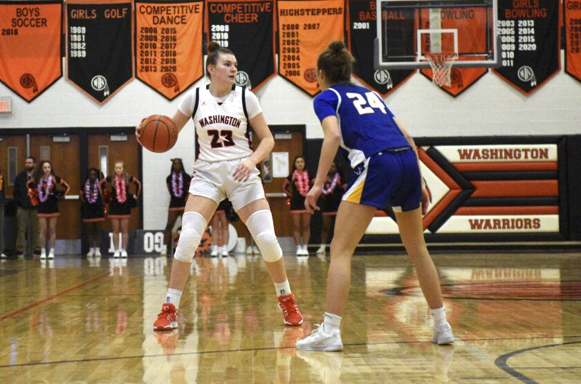 Sioux Falls Washington's Grace Peterson dribbles the ball while being guarded by O'Gorman's Ruby Moore on Tuesday, Jan. 14, 2025, at Washington High School in Sioux Falls.