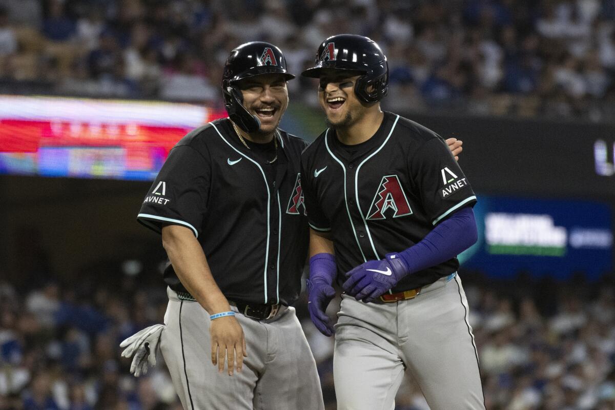 Arizona's Gabriel Moreno, right, celebrates with teammate Josh Naylor after hitting a two-run home run.