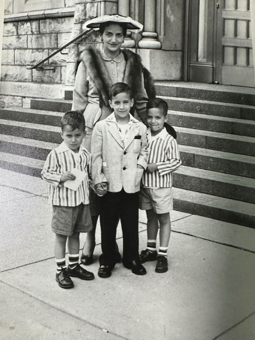 Robert Prevost, left, and his brothers John and Louis pose for a photo with their mother in this undated photo.