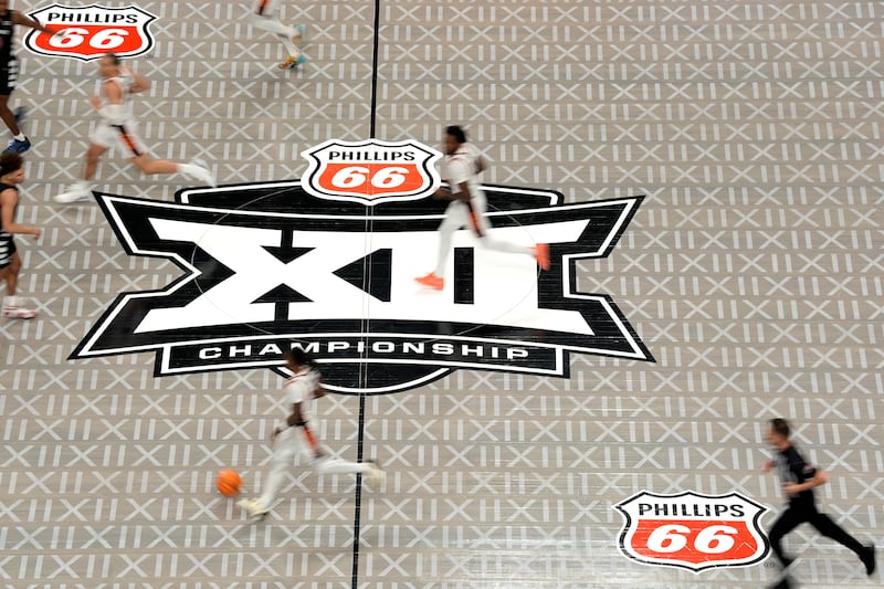 The Big 12 logo is seen on the court during the second half of game between Cincinnati and Oklahoma State in the first round of the Big 12 Conference tournament, Tuesday, March 11, 2025, in Kansas City, Mo.