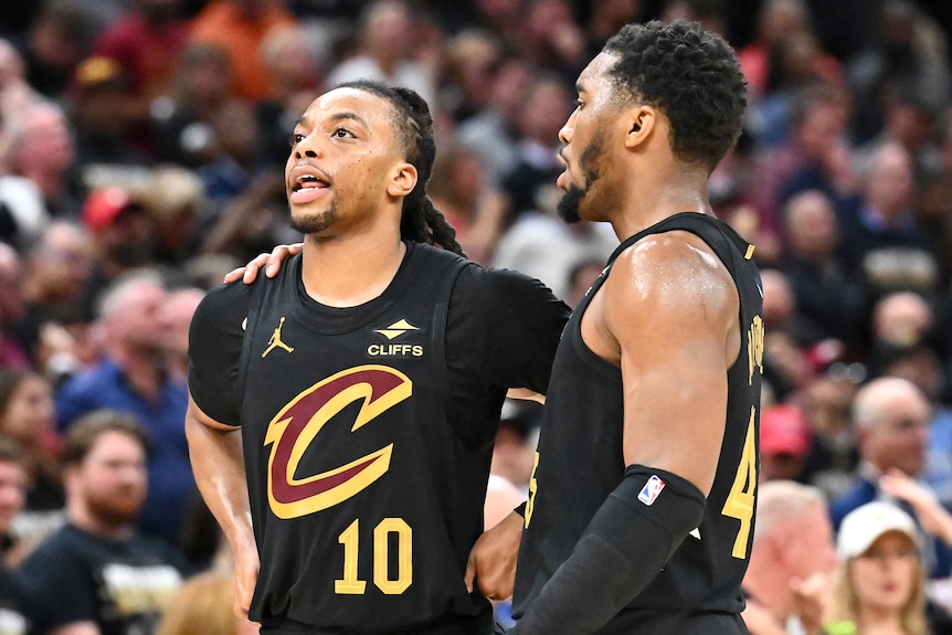 Donovan Mitchell with his arm around Darius Garland