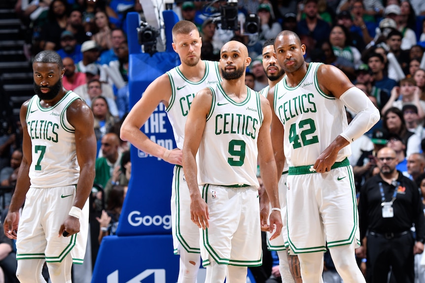Jaylen Brown, Derrick White, Al Horford and Kristaps Porzingis standing