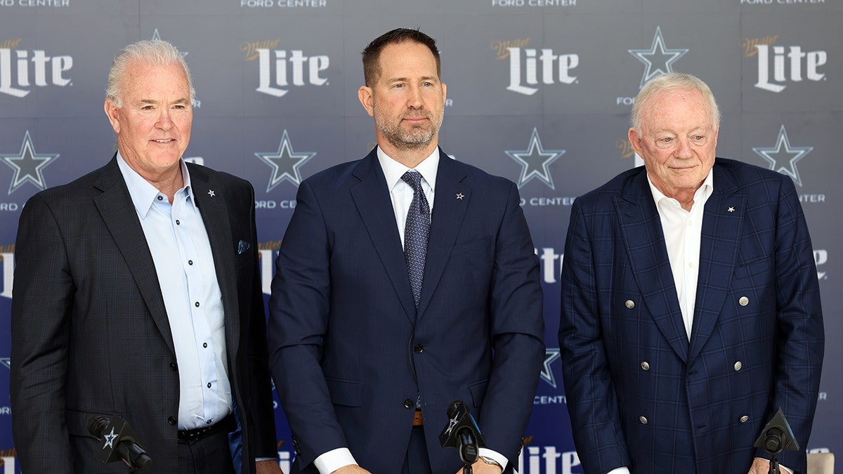 From left to right, Dallas Cowboys CEO Stephen Jones, head coach Brian Schottenheimer and owner Jerry Jones pose for pictures