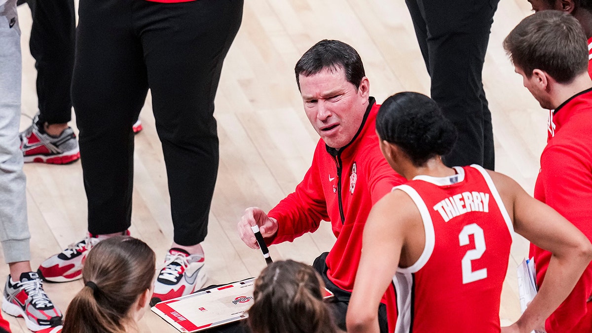 McGuff talks to team