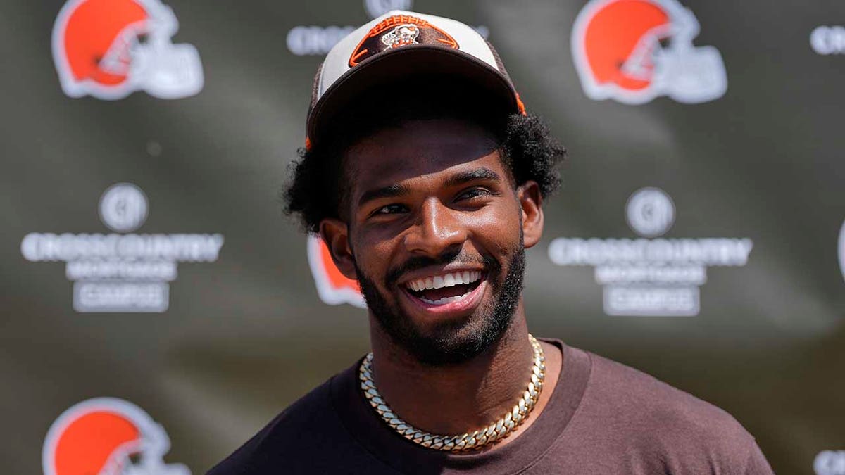 Shedeur Sanders looks on