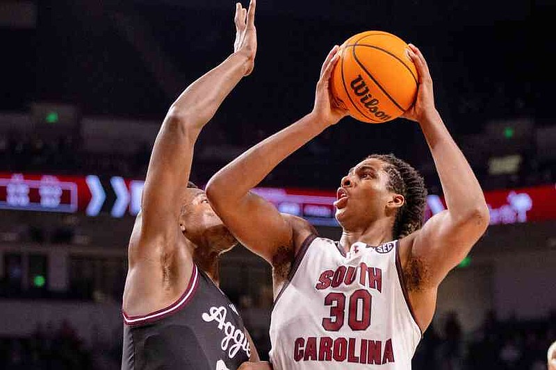 FILE - South Carolina forward Collin Murray-Boyles (30) shoots on Texas A&M forward Pharrel Payne (21) during the second half of an NCAA college basketball game Saturday, Feb. 1, 2025, in Columbia, S.C. (AP Photo/Scott Kinser, File)
