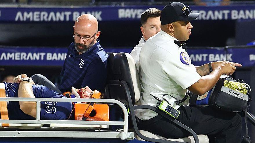 Hunter Bigge of the Tampa Bay Rays is taken off the field after getting hit by a foul ball